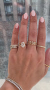 caption:Shown with 2.5ct oval in 18k rose gold, customized with leaf prongs