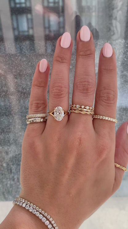 caption:Shown with 2.5ct oval in 18k rose gold, customized with leaf prongs