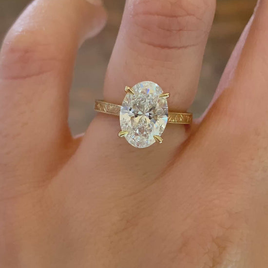 caption:Shown with 2.5ct oval in 14k yellow gold 