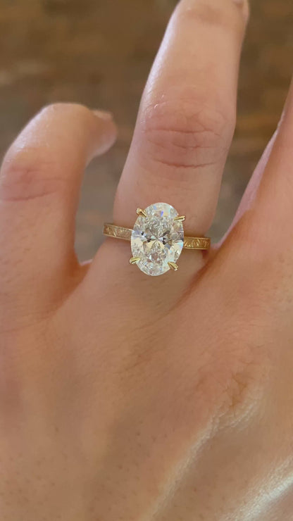 caption:Shown with 2.5ct oval in 14k yellow gold 