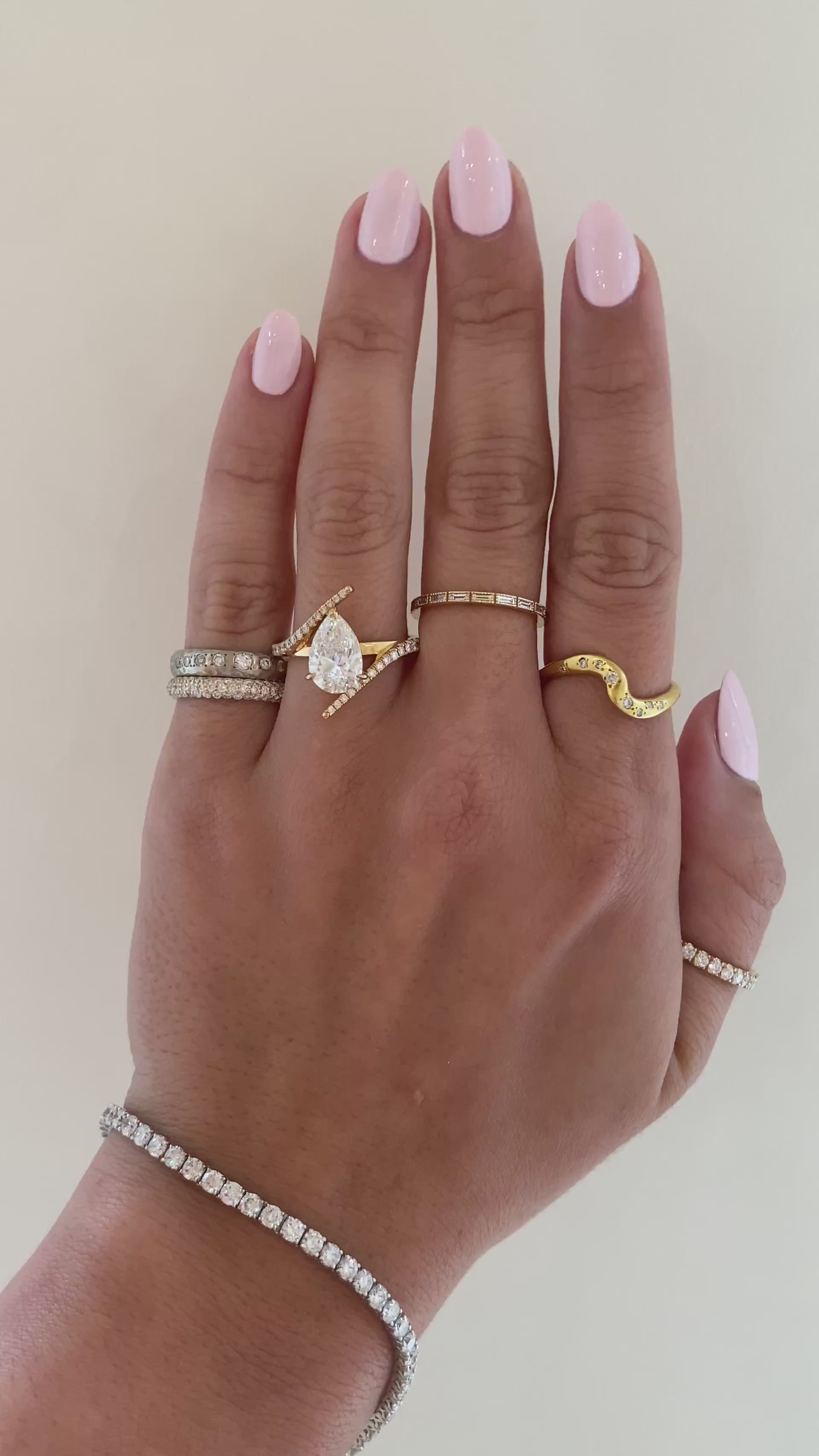 caption:Shown with 2ct pear in 18k yellow gold