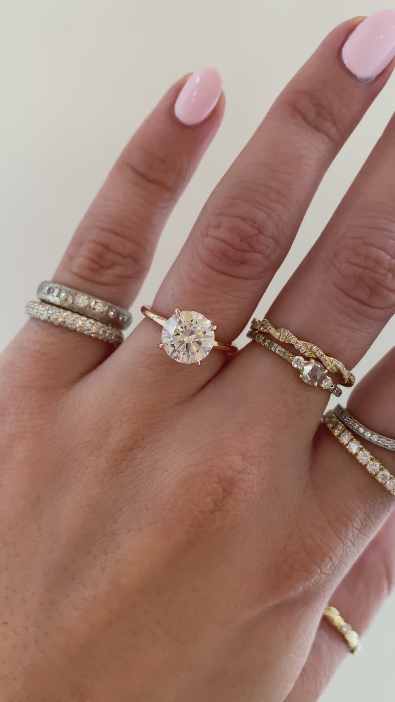 caption: Shown with 2ct round diamond in 14k rose gold