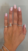 caption:Shown with 2.5ct pear diamond