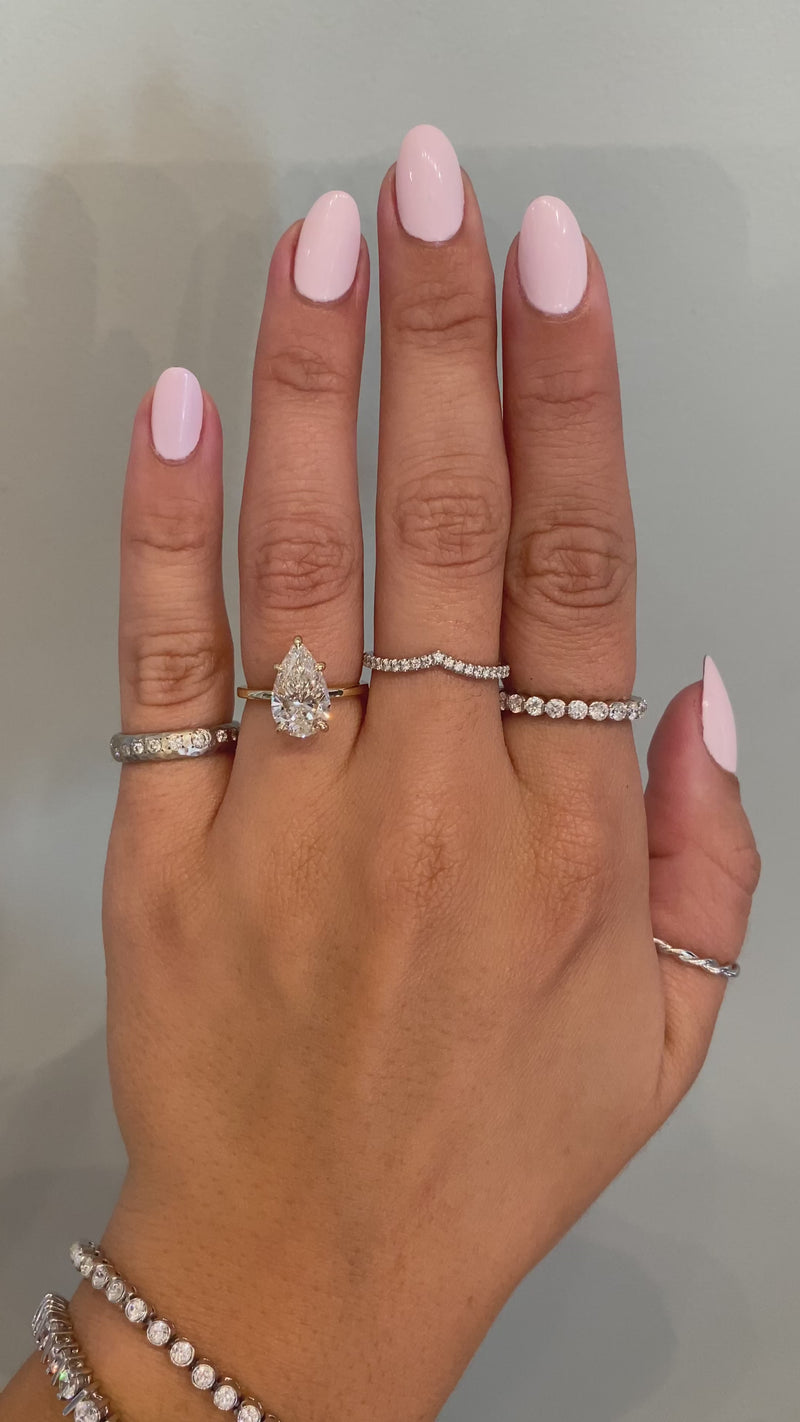 caption:Shown with 2.5ct pear diamond