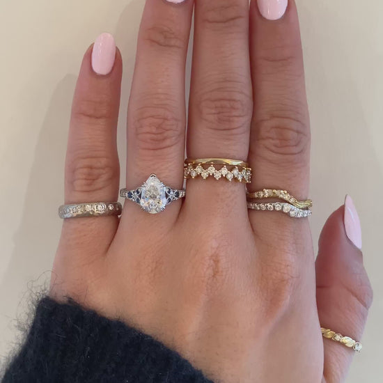 caption:Shown with a 2ct pear in platinum