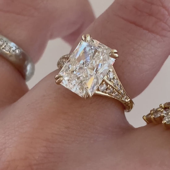 caption:Shown with 3ct radiant cut in 14k yellow gold 