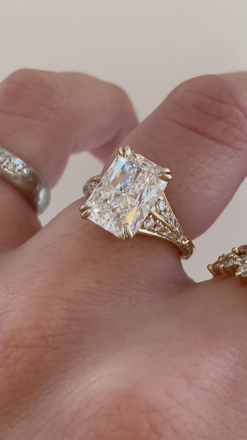 caption:Shown with 3ct radiant cut in 14k yellow gold 