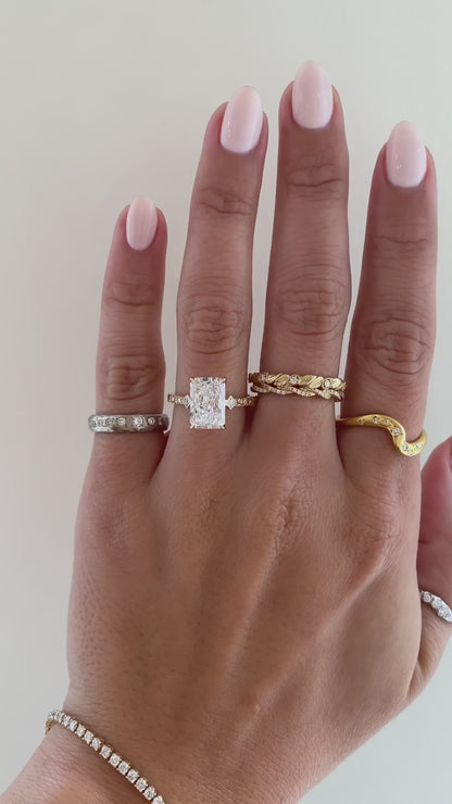 caption:Shown with 3ct radiant cut in 14k yellow gold 