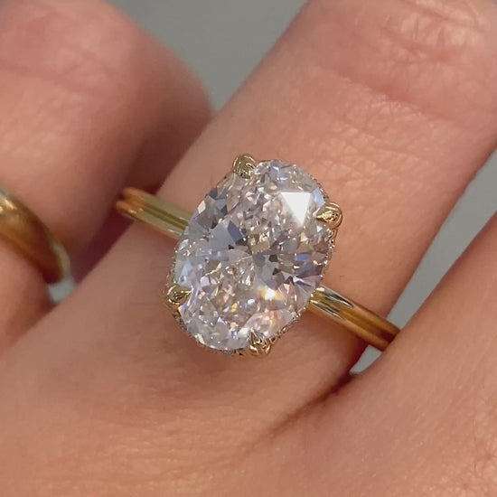 caption:Shown with 3ct oval diamond in 14k yellow gold 