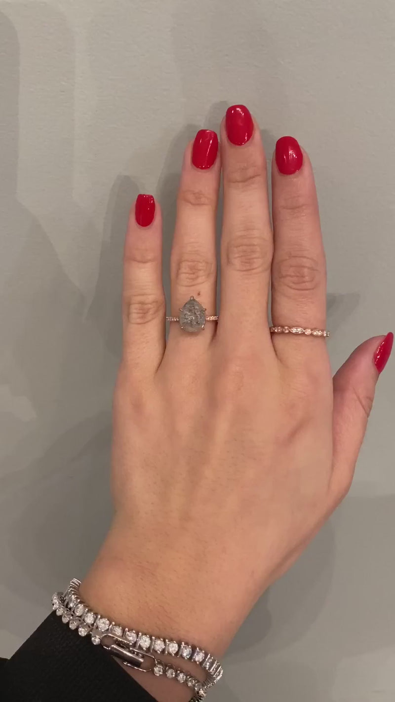 caption:Shown with 3ct pear salt & pepper diamond in mixed 14k rose gold & platinum