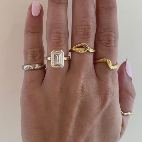 caption:Shown with 4ct emerald cut in 14k yellow gold