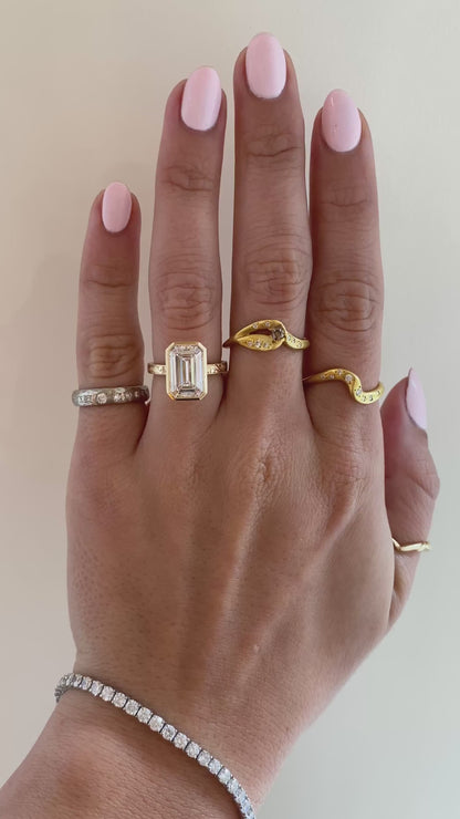 caption:Shown with 4ct emerald cut in 14k yellow gold