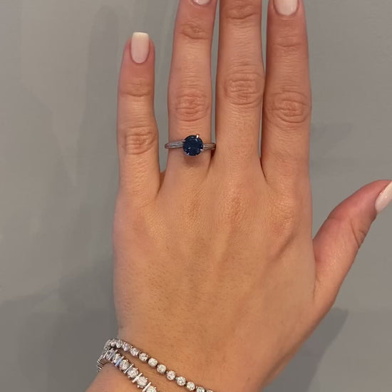 caption:Shown in 14k white gold with 2.02ct round blue sapphire