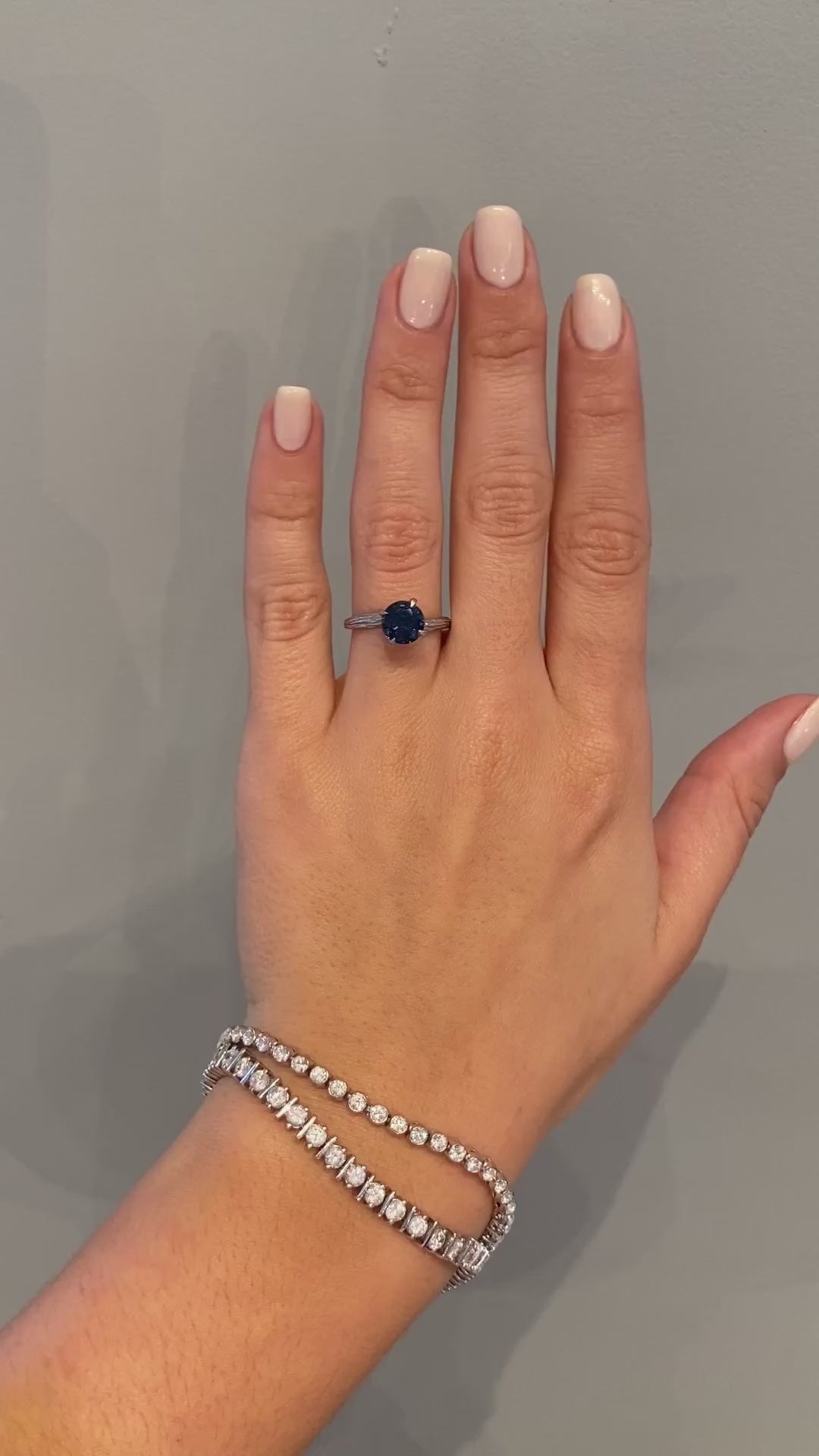 caption:Shown in 14k white gold with 2.02ct round blue sapphire