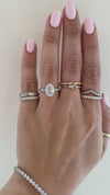 caption: Shown with 2.00ct oval diamond in 14k white gold