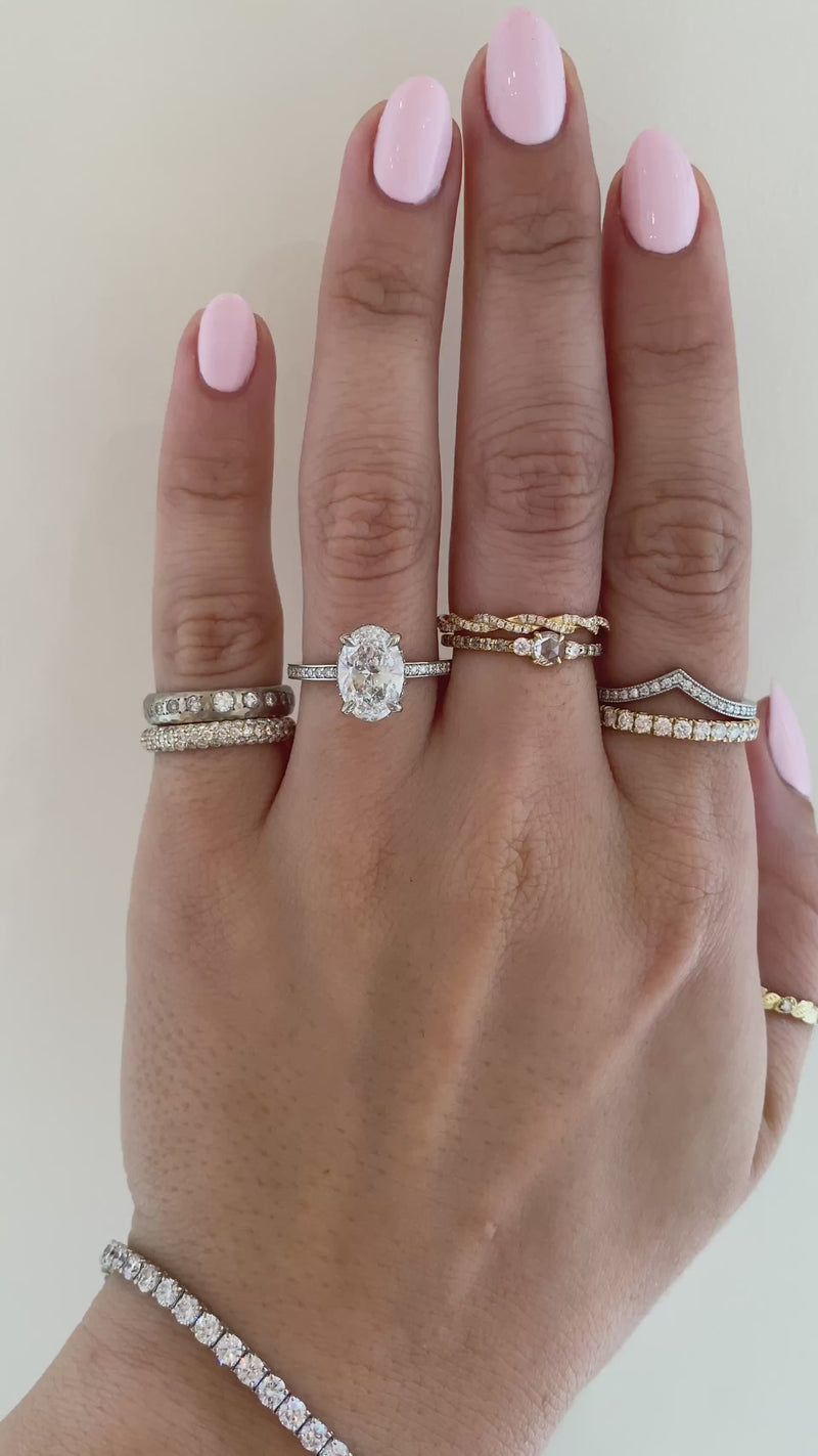 caption: Shown with 2.00ct oval diamond in 14k white gold