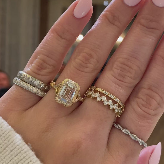 caption:Shown with 3ct emerald cut in 14k yellow gold 