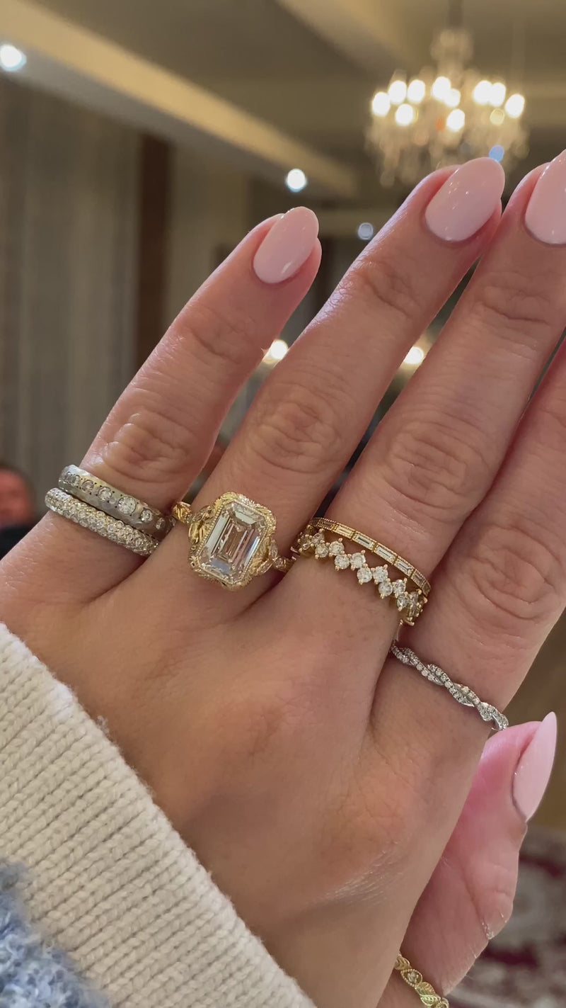 caption:Shown with 3ct emerald cut in 14k yellow gold 