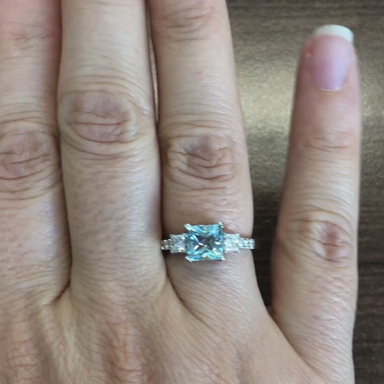 caption:Shown with princess cut aquamarine in platinum