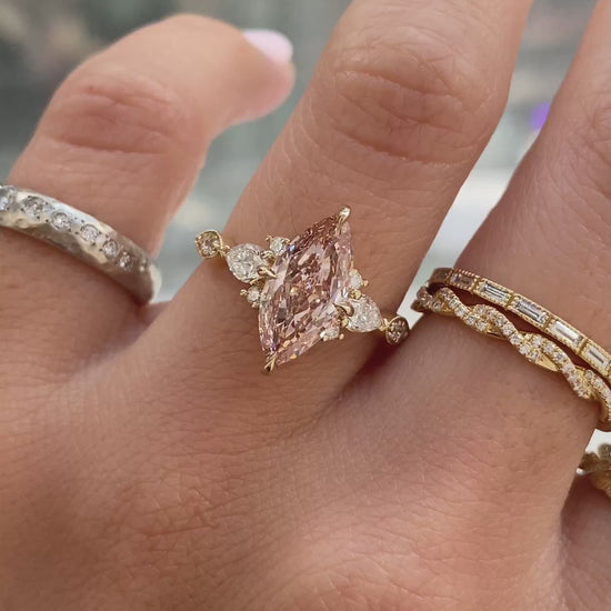 caption:Shown with 2ct fancy pink marquise in 14k yellow gold