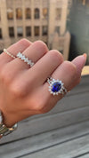 caption:Shown with 2.5ct oval sapphire in platinum, stacked with Sarah wedding band
