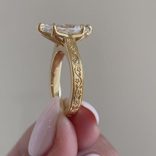 caption:Shown with 2.7ct marquise in 18k yellow gold 