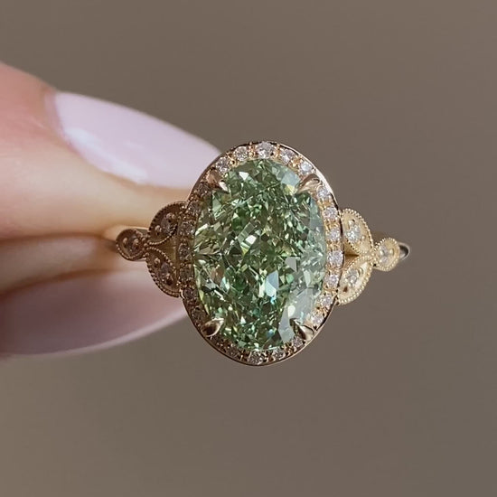 caption:Shown with 3ct fancy green oval in 14k yellow gold 