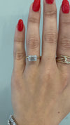 caption:Shown with emerald cut diamond in mixed metal setting