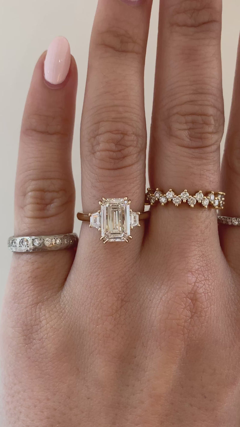 caption:Shown with 2.5ct emerald cut diamond in 14k yellow gold with double prongs