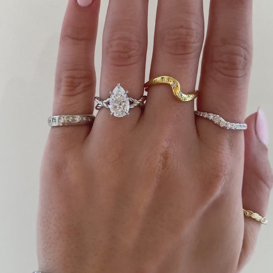 caption:Shown with 2ct pear in platinum