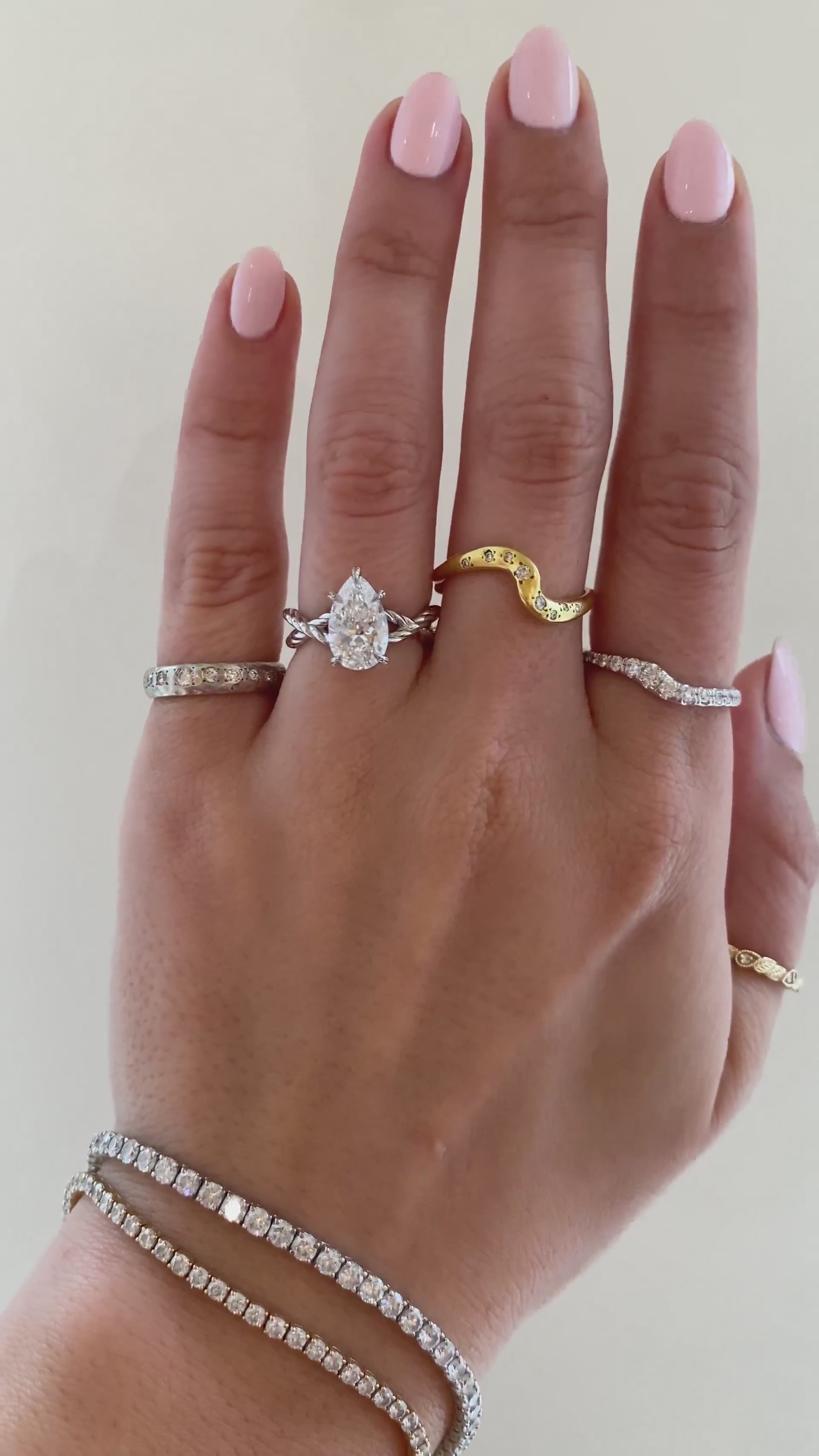 caption:Shown with 2ct pear in platinum