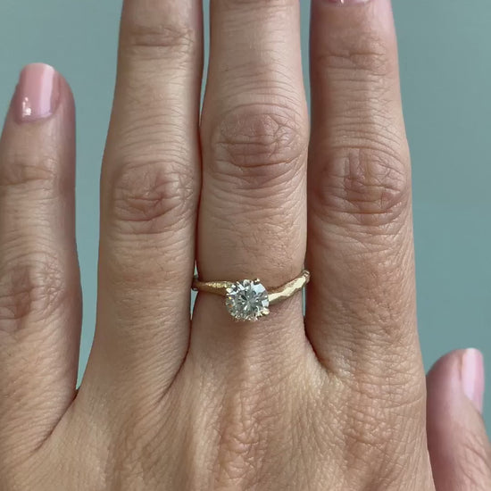 caption:Shown with 1ct round diamond in brushed 14k yellow gold 