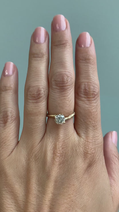 caption:Shown with 1ct round diamond in brushed 14k yellow gold 