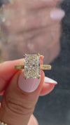 caption:Shown with 3ct radiant cut in 14k yellow gold