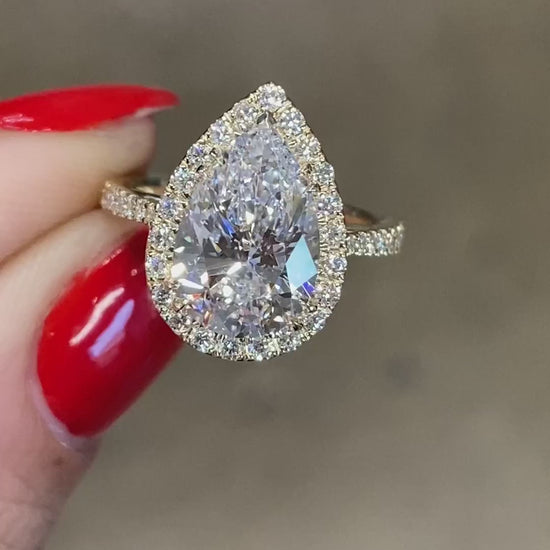 caption:Shown with 2.5ct pear in 14k yellow gold