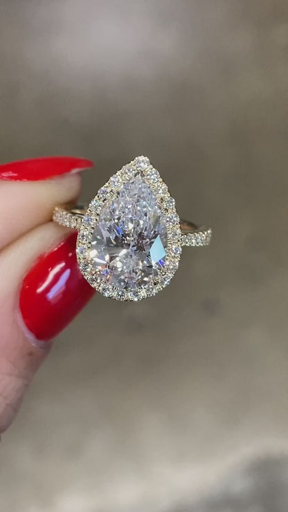 caption:Shown with 2.5ct pear in 14k yellow gold
