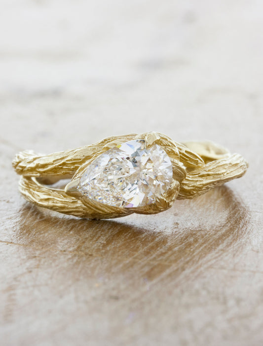 caption:Shown with 1ct pear cut diamond in 14k yellow gold