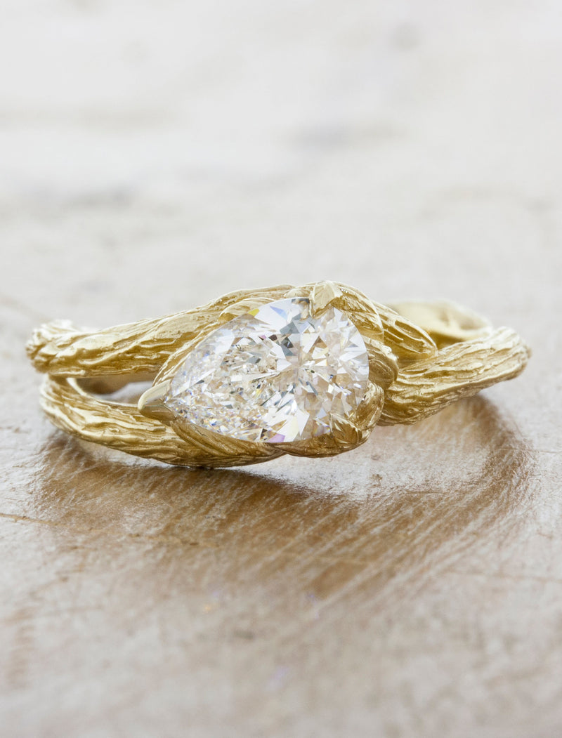 caption:Shown with 1ct pear cut diamond in 14k yellow gold