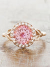 caption:Customized with round pink sapphire & custom  halo in 14k rose gold
