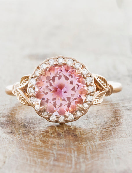 caption:Shown with a round pink sapphire, and customized halo