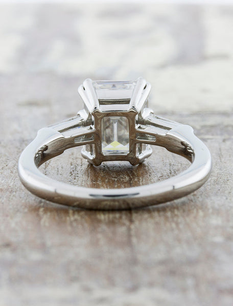 Three stone emerald diamond engagement ring