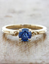 caption:Shown with round blue sapphire in 14k yellow gold