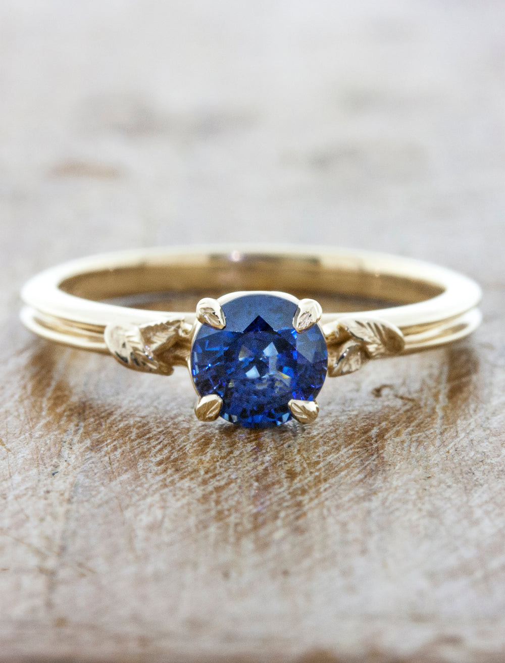 caption:Shown with round blue sapphire in 14k yellow gold