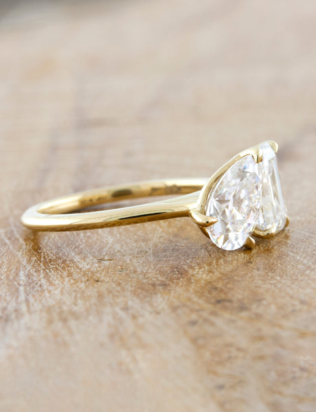 caption:Shown with a 1.20ct pear & 1.75ct emerald cut diamond in 14k yellow gold