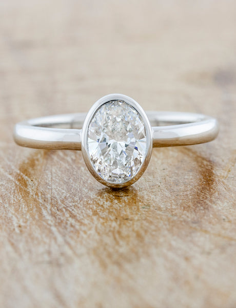 caption:Customized with .90ct oval diamond in platinum