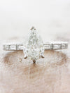 caption:Shown with 1.20ct pear diamond in platinum