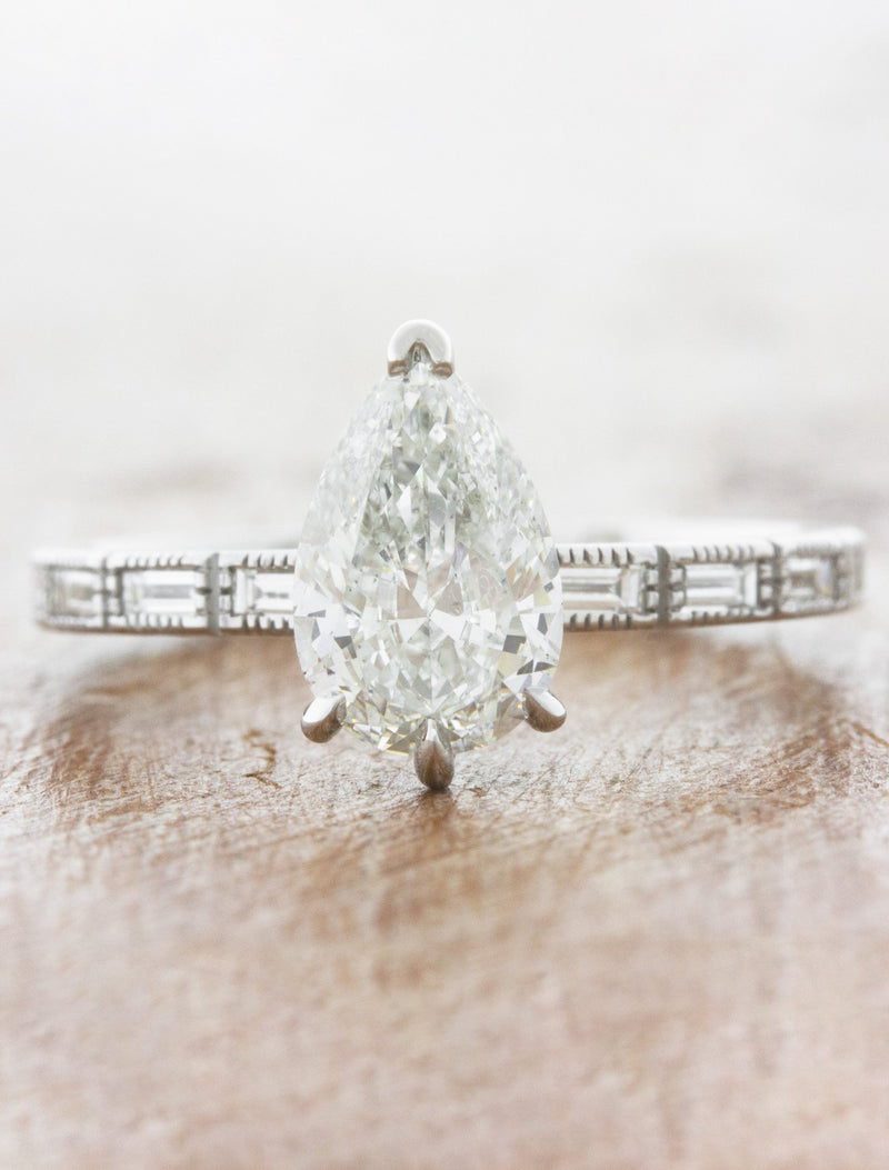 caption:Shown with 1.20ct pear diamond in platinum