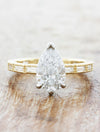 caption:Shown with 1.20ct pear diamond in two toned setting