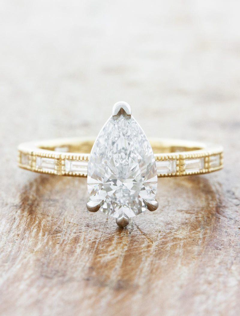 caption:Shown with 1.20ct pear diamond in two toned setting