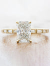 caption:Shown with 1.85ct radiant cut diamond in 14k yellow gold